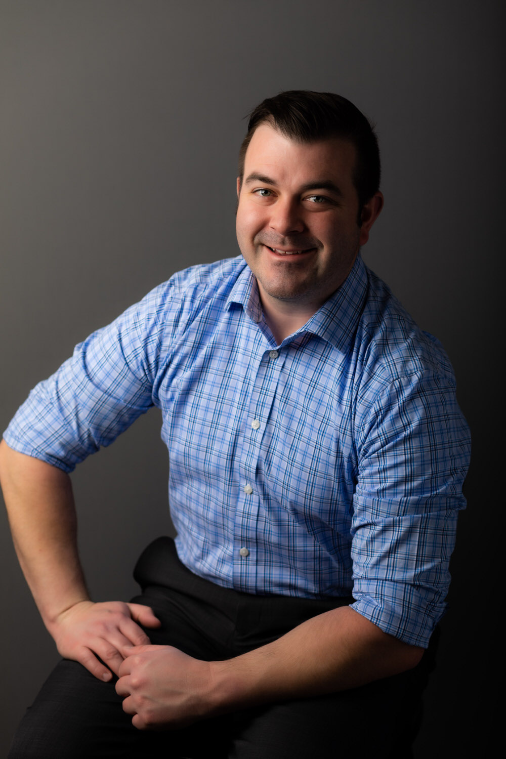 Portrait of a man in a blue shirt Columbus MS headshot lifestyle photographer