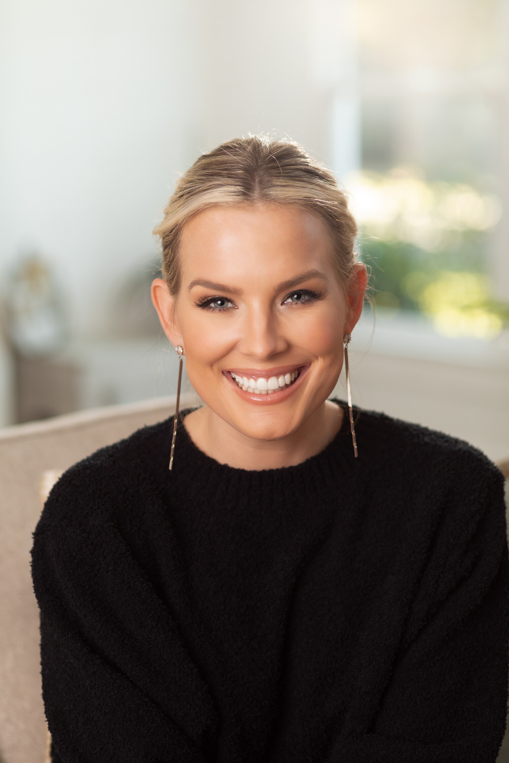 Headshot of a woman in a black sweater in a lifestyle setting Columbus MS photographer
